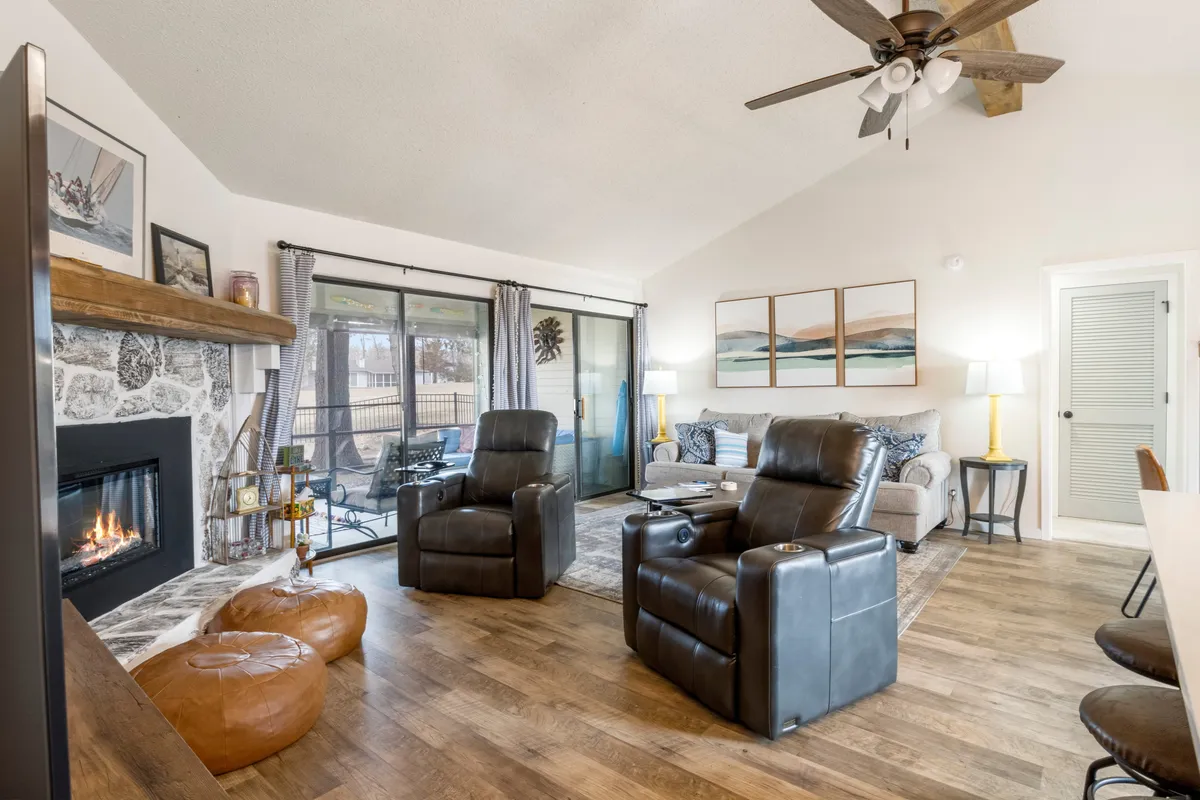 A cozy interior with a fireplace, plush leather recliners, exposed wooden beams, and tasteful artwork. The atmosphere is warm and inviting, ideal for relaxing by the fire after a day exploring wineries or scenic trails. The space suggests comfort and connection, reinforcing the wellness and romantic themes of the section.